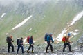 Group of travelers hiking in mountains in Austria. Royalty Free Stock Photo