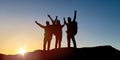 Group of travellers with backpacks over sunrise Royalty Free Stock Photo