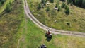 Group travels on ATVs and UTVs on the nature. Top view of people riding Quad bikes in nature
