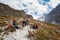 Group of trekkers backpackers ascending from Ala-Archa to Ak-Sai Racek Hut and Glacier. Ala Archa Alpine National Park Landscape Royalty Free Stock Photo