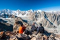 Group of trekkers climbers alpinists conquering Pik Uchitel peak from Racek Hut in Ala Archa Alpine National Park Landscape near