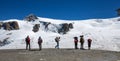 Group of trekkers standing in front of the Plateau Rosa in Val D`Aosta, Italy.