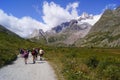 Trekkers walking on a mountain path in Val Veny, Aosta Valley Italy