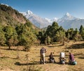 A group of trekkers in watching panorama of Mount Machapuchare Fishtail, Poonhill circuit, Annapurna circuit. Himalayas, Nepal.