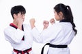 Two TaeKwonDo Karate national athlete punch on white background isolated