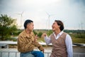 Group of two LGBTQ friends sitting and talking laughing happy on the roof of the coffee shop Royalty Free Stock Photo