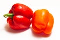 A group of two peppers.One vegetable is red, the other orange. Royalty Free Stock Photo
