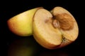 Red jonagold apple isolated on black glass Royalty Free Stock Photo