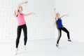 Group of two young fit women having fun while dancing Royalty Free Stock Photo