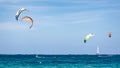 Group of unidentified people kitesurfing in indian ocean