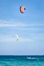 Group of unidentified people kitesurfing in indian ocean