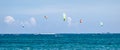 Group of unidentified people kitesurfing in indian ocean