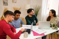 Group of university colleagues studying together at shared students house. Royalty Free Stock Photo