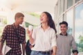 Group of university students walking outside together in campus, Happy Diverse students team concept. Royalty Free Stock Photo