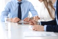 Group of unknown business people discussing questions at meeting in modern office, close-up of hands. Managers at