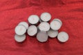 Group of tea light candles on a red cloth Royalty Free Stock Photo