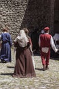 Group of unrecognizable people dressed in medieval costumes