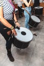 Group of unrecognizable women armed with a drum