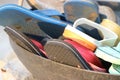Group of used footwear placed in a basket, Colorful flipflop in a basket