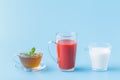 Group Useful Colorful Beverages Drink Milk Tea Juice Water on Blue Background