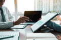 Group of usiness partnership coworkers working to chart company financial statements report and profits work progress and planning Royalty Free Stock Photo