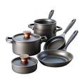 A collection of dark metal cookware including pots and pans on a black background Royalty Free Stock Photo