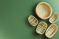Collection of Empty Woven Bamboo Baskets on Green Background Royalty Free Stock Photo
