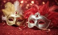 A group of Venetian or Mardi Gras masks on a dark, glittery surface with a bokeh light effect in the background. Royalty Free Stock Photo