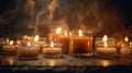 A group of vintage candles flicker softly against a dark and romantic backdrop