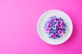 Group of violet and magenta petals of hyacinth flower in a white