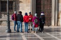 Granada, SPAIN; 01/20/2020: A group of visitors attended the explanation of the tour guide Royalty Free Stock Photo