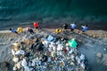 Group of volunteers cleaning garbages on the beach, birds eyes view, generative AI