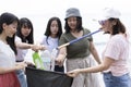 Group of volunteers cleaning sea beach