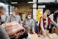 Group of volunteers in community charity donation center, food bank and coronavirus concept. Royalty Free Stock Photo