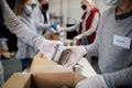 Group of volunteers in community donation center, food bank and coronavirus concept. Royalty Free Stock Photo