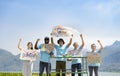 group of volunteers holding environmental campaign signs standing by the river