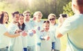 Group of volunteers taking picture by smartphone Royalty Free Stock Photo