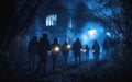 Group walking with flashlights exploring abandoned building at night Royalty Free Stock Photo