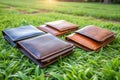 Group of Wallets on Green Grass Royalty Free Stock Photo