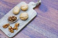 Group of walnut in wooden bowl on wood background, copy space, super food concept