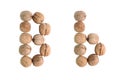 The group of walnuts on white background, making letter B. Studio shot Royalty Free Stock Photo