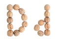 The group of walnuts on white background, making letter D. Studio shot Royalty Free Stock Photo