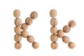 The group of walnuts on white background, making letter K. Studio shot Royalty Free Stock Photo