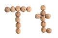 The group of walnuts on white background, making letter T. Studio shot Royalty Free Stock Photo