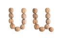 The group of walnuts on white background, making letter U. Studio shot Royalty Free Stock Photo