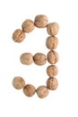 The group of walnuts on white background, making number 3. Studio shot Royalty Free Stock Photo