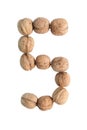 The group of walnuts on white background, making number 5. Studio shot Royalty Free Stock Photo