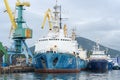 Group of warships Coast Guard of Border Guard Service of Russian FSB anchored at pier in seaport