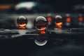 a group of water droplets on the ground with a car in the background Royalty Free Stock Photo