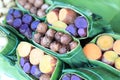 Group of waternut, chinese water chestnut, purple and yeloow sweet potato in banana leaf plate in the fresh market